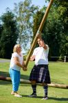 Tossing the caber at Highland games experience
